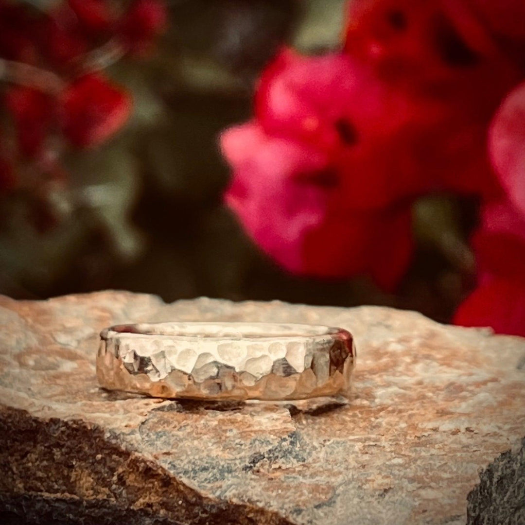 14k yellow gold cremation ring with hammered finish. Discreet, durable and watersafe.  The cremation ash is compressed within its core. I individually hand make each ring to honor your loved one.