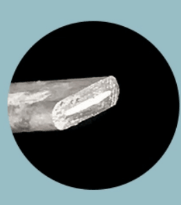 Cross section of cremation ring.    The ash is the white core of the ring.  It is completely sealed within the sterling silver ring.  I developed this unique process to provide durable, discreet and water safe cremation rings.