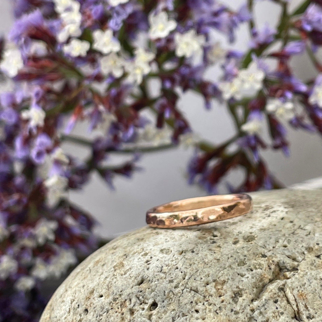 14k rose gold cremation ring with hammered finish.  The ash is compressed within the ring's core during its creation.  This durable cremation ring is suitable for everyday wear.